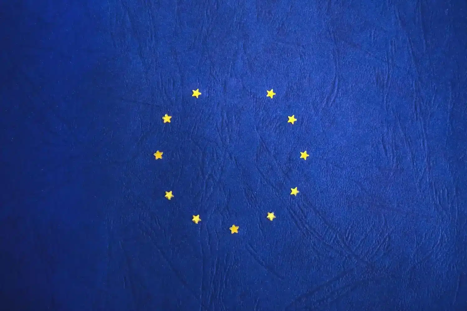 TheWhatTheWhy Twelve yellow stars in a circle on a blue background.