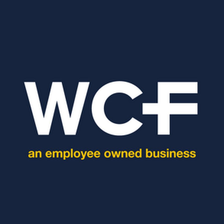 WCF White letters "WCF" with yellow text "an employee owned business" on a dark blue background.